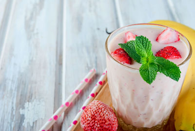 Close-up of smoothie with fruits on table