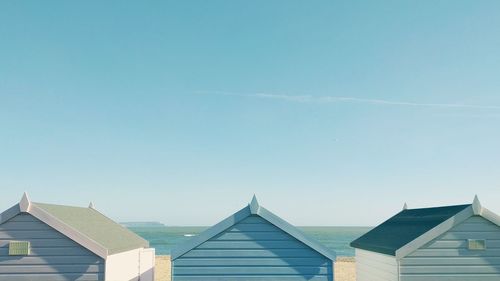 Beach huts against blue sky