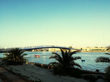 Bridge over river against clear sky