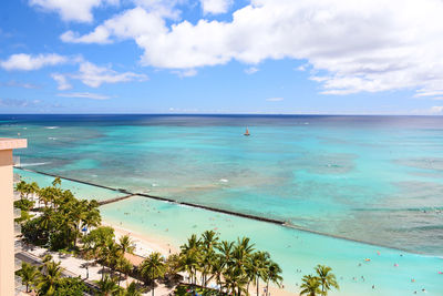 Sailboat off the shore of waikiki beach in honolulu on oahu, hawaii. 