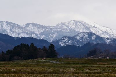 Scenic view of snowcapped mountains against sky
