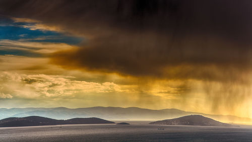 Scenic view of mountains against sky during sunset