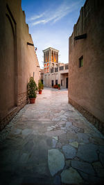 Alley amidst buildings in city