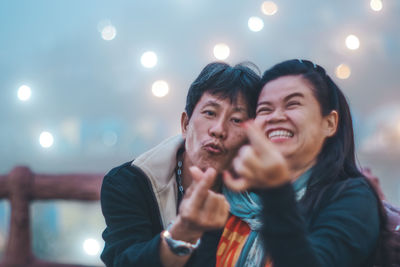 Young man and woman at night