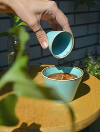 Hand holding coffee cup