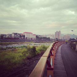 View of city against cloudy sky