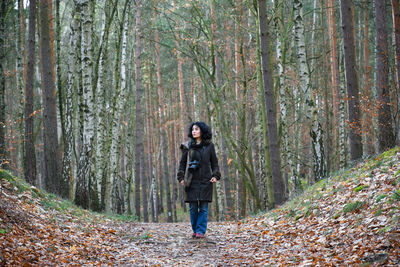 Full length of woman in forest during autumn