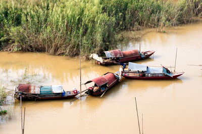 High angle view of boats moored on river