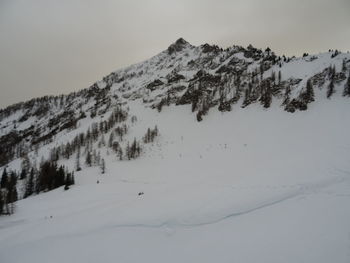 Snow covered mountains against sky