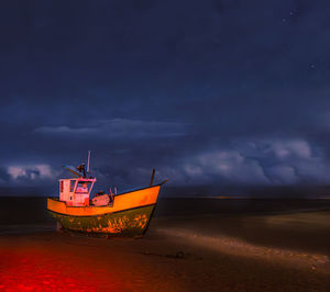 Fishing boat on the baltic beach in jantar at night