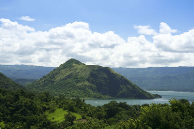 Scenic view of landscape and mountains against sky