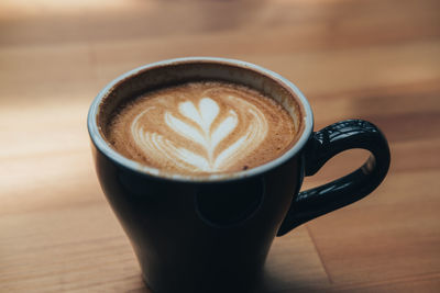 Close-up of cappuccino on table