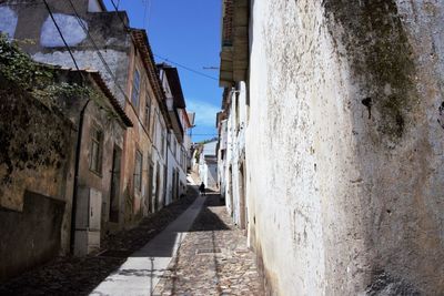 Narrow alley amidst buildings in town