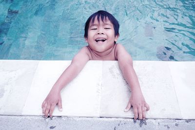 Portrait of smiling boy in swimming pool