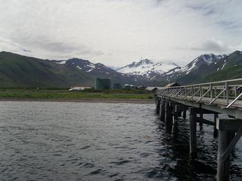 Scenic view of mountains against cloudy sky