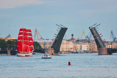 Boats in sea against sky