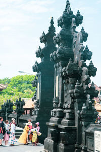 Group of people outside temple