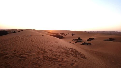 Scenic view of desert against clear sky