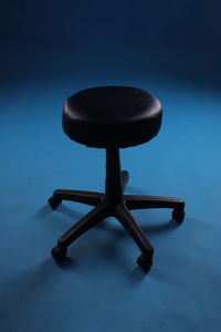 High angle view of chair on table