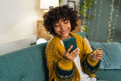 Young woman using mobile phone