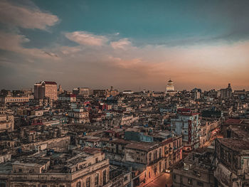 High angle view of city against sky during sunset