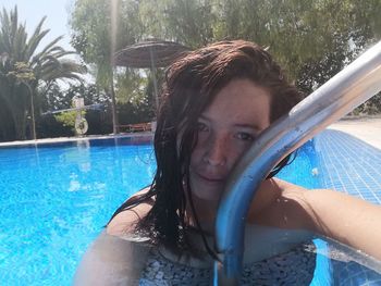 Portrait of young woman in swimming pool