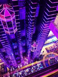 Low angle view of illuminated modern building at night