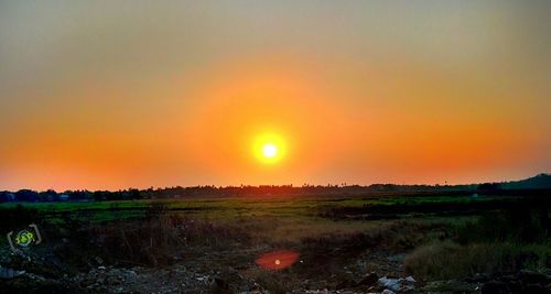 Scenic view of landscape at sunset