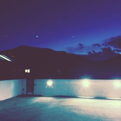 Scenic view of mountains against sky at night