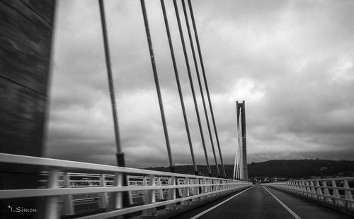 View of highway against cloudy sky