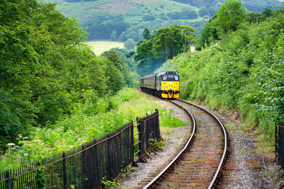 Yellow train approaching station