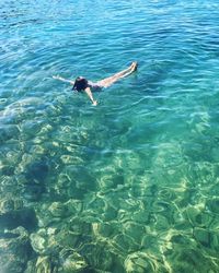 High angle view of man swimming in sea