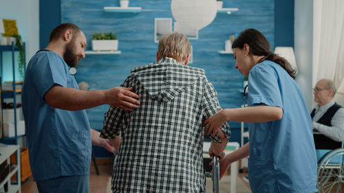 Doctor helping patient at hospital