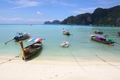 Boats moored in sea