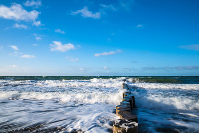 Scenic view of sea against blue sky