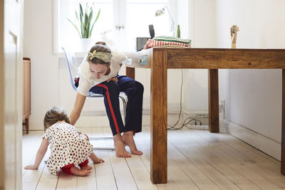 Podcaster taking care of daughter while vlogging at home