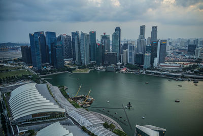 High angle view of bay and buildings against sky