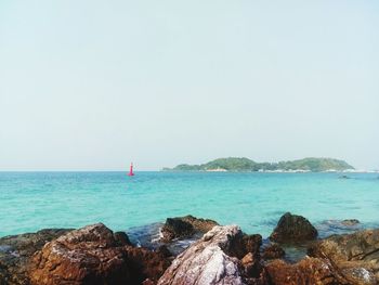 Scenic view of sea against clear sky