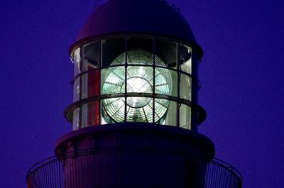 Low angle view of water tower against blue sky