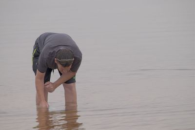 Full length of woman on sea shore