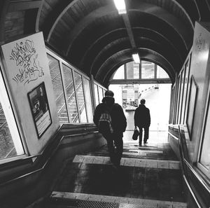 Woman walking in tunnel