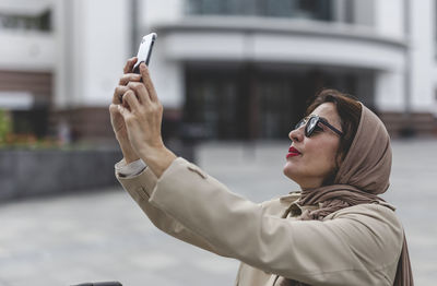 Woman taking selfie from mobile phone