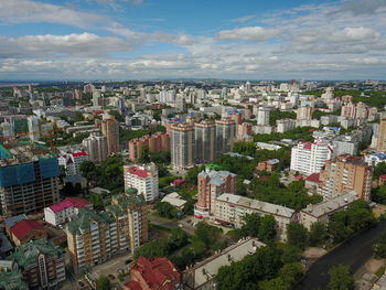 High angle view of city buildings against sky