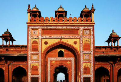 Facade of agra fort against clear sky