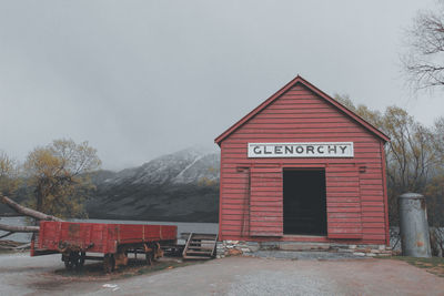 View of building and mountain against sky