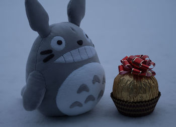 Close-up of stuffed toy over white background