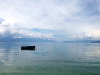 An abandoned boat on lake ohrid.