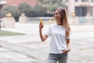 Young woman using mobile phone