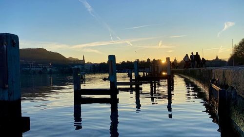 Scenic view of lake against sky during sunset