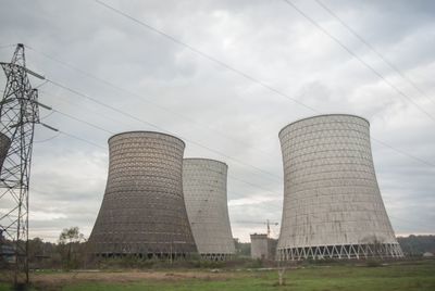 Low angle view of factory against sky